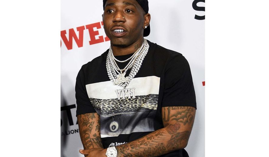 FILE - In this Aug. 20, 2019 file photo, rapper YFN Lucci, whose real name is Rayshawn Bennett, attends the world premiere of the final season of Starz TV&#39;s &amp;quot;Power&amp;quot; in New York. Police said Tuesday, Jan. 12, 2021, they are searching for Bennett, who is wanted on murder and other charges following a fatal shooting last month in Atlanta.  (Photo by Evan Agostini/Invision/AP, File)
