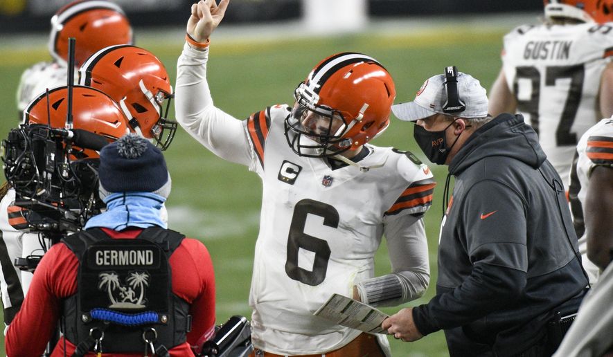 Cleveland Browns offensive coordinator Alex Van Pelt, right, talks with quarterback Baker Mayfield (6) on the sideline during the second half of an NFL wild-card playoff football game against the Pittsburgh Steelers in Pittsburgh, Sunday, Jan. 10, 2021. (AP Photo/Don Wright)