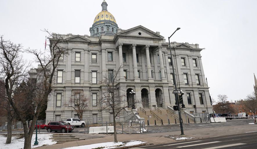 FILE—The State Capitol is shown in this file photograph taken Monday, Dec. 14, 2020, in downtown Denver. The Colorado Legislature opened Wednesday, Jan. 13, 2021, for a brief, three-day session to swear in new members and adjust several pandemic relief laws before adjorning until February because of coronavirus concerns. (AP Photo/David Zalubowski, File)