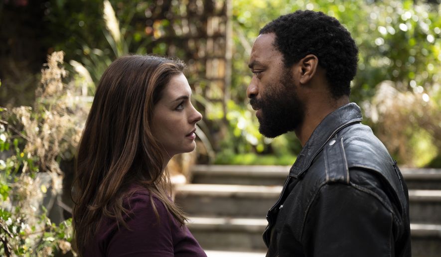 This image released by HBO Max shows Anne Hathaway and Chiwetel Ejiofor in a scene from &amp;quot;Lockdown.&amp;quot; (Susie Allnutt/HBO Max via AP)