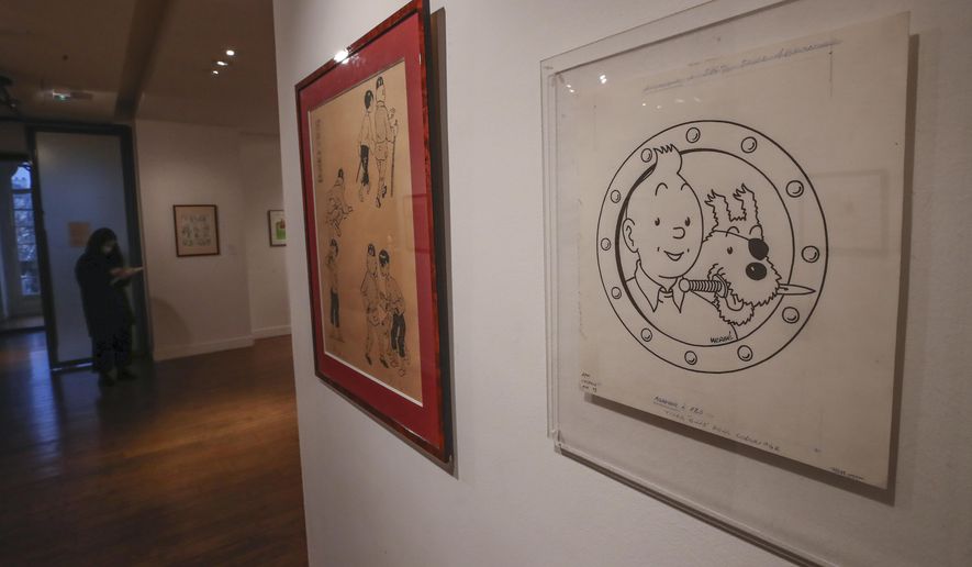 The Chinese inked on paper original of the comic character Tintin and his dog snowy as a pirate made for an advertising and drawn by Belgian creator Herge, is displayed at the Artcurial auction house in Paris, Wednesday, Jan. 13, 2021. The art work with an estimates value of 3000 to 5000 euros (US $ 3650 to 6080), is going on sale Thursday. (AP Photo/Michel Euler)