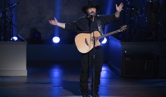 FILE - In this March 4, 2020, file photo, Garth Brooks performs on stage during the 2020 Gershwin Prize Honoree&#x27;s Tribute Concert at the DAR Constitution Hall in Washington. (Photo by Brent N. Clarke/Invision/AP)