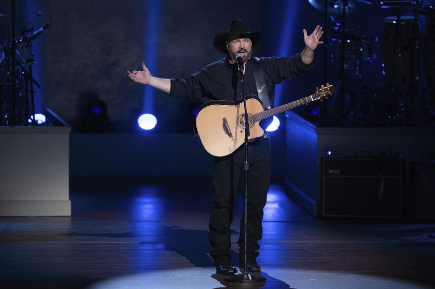 FILE - In this March 4, 2020, file photo, Garth Brooks performs on stage during the 2020 Gershwin Prize Honoree&#x27;s Tribute Concert at the DAR Constitution Hall in Washington. (Photo by Brent N. Clarke/Invision/AP)