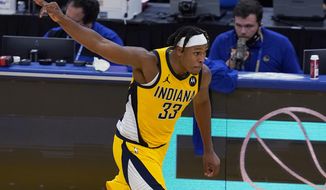 Indiana Pacers center Myles Turner celebrates after shooting a 3-point basket against the Golden State Warriors during the second half of an NBA basketball game in San Francisco, Tuesday, Jan. 12, 2021. (AP Photo/Jeff Chiu)