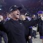 FILE - Baltimore Ravens head coach John Harbaugh celebrates after beating the Los Angeles Rams in an NFL football game  in Los Angeles, in this Nov. 25, 2019, file photo. Home-field advantage in the playoffs is overrated for Ravens coach John Harbaugh, who has found that the road to success in the postseason usually involves packing his bags and getting the heck out of Baltimore. Last week&#x27;s 20-13 victory in Tennessee was Harbaugh&#x27;s eighth on the road in the playoffs, the most by any coach in NFL history, breaking a tie with Tom Landry and Tom Coughlin. (AP Photo/Marcio Jose Sanchez, FIle)