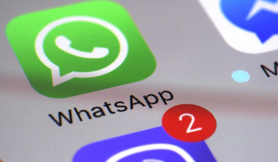 FILE - This Friday, March 10, 2017, file photo shows the WhatsApp communications app on a smartphone, in New York. In early January 2021, encrypted messaging apps Signal and Telegram are seeing huge upticks in downloads from Apple and Google&#39;s app stores, while WhatsApp&#39;s growth is on the decline following a privacy fiasco where the company was forced to clarify a message it sent to users. (AP Photo/Patrick Sison, File)