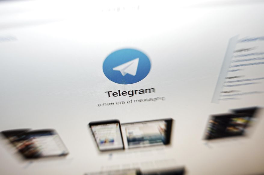 In this Thursday, June 13, 2019, file photo, the website of the Telegram messaging app is seen on a computer&#39;s screen in Beijing. In early January 2021, encrypted messaging apps Signal and Telegram are seeing huge upticks in downloads from Apple and Google&#39;s app stores, while WhatsApp&#39;s growth is on the decline following a privacy fiasco where the company was forced to clarify a message it sent to users. (AP Photo/Andy Wong, File) **FILE**