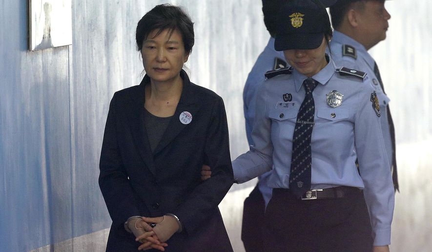FILE - In this Oct. 10, 2017, file photo, former South Korean President Park Geun-hye, left, arrives to attend a hearing on the extension of her detention at the Seoul Central District Court in Seoul, South Korea. South Korea’s top court upheld 20-year prison term for Park over corruption on Thursday, Jan. 14, 2021. (AP Photo/Ahn Young-joon, File)