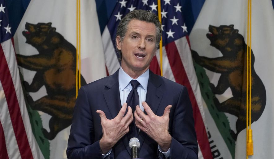 FILE - In this Jan. 8, 2021, file photo, California Gov. Gavin Newsom outlines his 2021-2022 state budget proposal during a news conference in Sacramento, Calif. California Democratic leaders are being criticized after attempting to link the insurrection at the U.S. Capitol with efforts to recall Newsom. State Democratic Party Chair Rusty Hicks led a group of Democratic officials who described the effort to remove Newsom as a “coup” and claimed, without evidence, that those involved were far-right extremists. (AP Photo/Rich Pedroncelli, Pool, File)