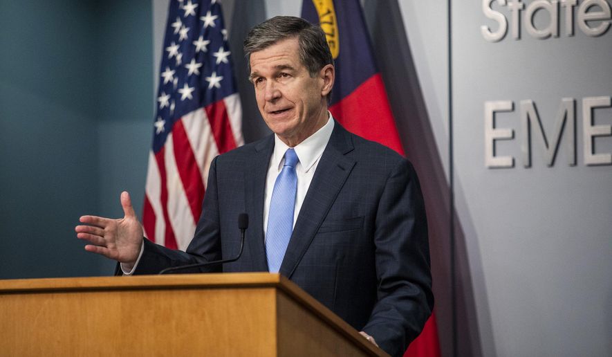 Gov. Roy Cooper speaks during a briefing on North Carolina&#39;s coronavirus pandemic response at the North Carolina Emergency Operations Center, Tuesday, Jan. 12, 2021, in Raleigh, N.C. (Travis Long/The News &amp;amp; Observer via AP)  **FILE**