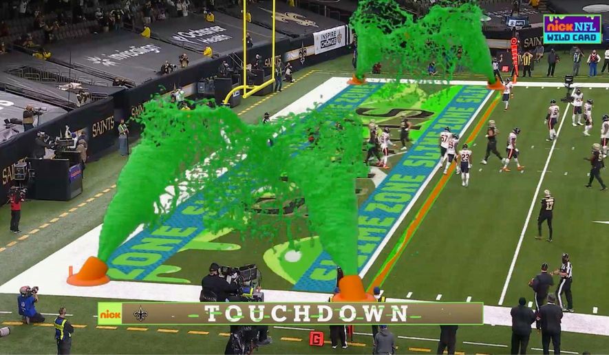 Virtual slime cannons go off in the end zone after a touchdown during Nickelodeon&#39;s kid-focused broadcast of the NFL wild-card playoff game between the Chicago Bears and New Orleans Saints at the Superdome, Sunday,  Jan. 10, 2021 in New Orleans. The positive reviews for Nickelodeon&#39;s kids-focused broadcast of last Sunday&#39;s NFL playoff game showed the potential of alternate broadcasts of sporting events. The success of that broadcast has led to many wondering what other sports it could expand to and when we might see it again in the NFL? (CBS/Viacom via AP)