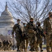 Members of the National Guard patrol outside the Capitol Building on Capitol Hill in Washington, Thursday, Jan. 14, 2021. (AP Photo/Andrew Harnik)
