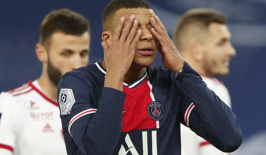 PSG&#39;s Kylian Mbappe reacts after missing a chance during the French League One soccer match between Paris Saint-Germain and Brest at the Parc des Princes in Paris, Saturday, Jan. 9, 2021. (AP Photo/Francois Mori)