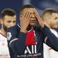 PSG&#39;s Kylian Mbappe reacts after missing a chance during the French League One soccer match between Paris Saint-Germain and Brest at the Parc des Princes in Paris, Saturday, Jan. 9, 2021. (AP Photo/Francois Mori)