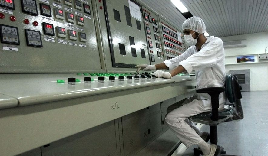 In this Feb. 3, 2007 file photo, a technician works at the Uranium Conversion Facility just outside the city of Isfahan, Iran, 255 miles (410 kilometers) south of the capital Tehran.  (AP Photo/Vahid Salemi, File)   **FILE**