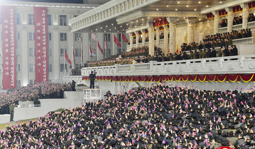 In this photo provided by the North Korean government, people wave the national flags as North Korean leader Kim Jong Un, center top, attends a military parade, at Kim Il Sung Square in Pyongyang, North Korea Thursday, Jan. 14, 2021. North Korea rolled out developmental ballistic missiles designed to be launched from submarines and other military hardware in a parade that punctuated leader Kim Jong Un’s defiant calls to expand his nuclear weapons program. Independent journalists were not given access to cover the event depicted in this image distributed by the North Korean government. The content of this image is as provided and cannot be independently verified. Korean language watermark on image as provided by source reads: &amp;quot;KCNA&amp;quot; which is the abbreviation for Korean Central News Agency. (Korean Central News Agency/Korea News Service via AP)