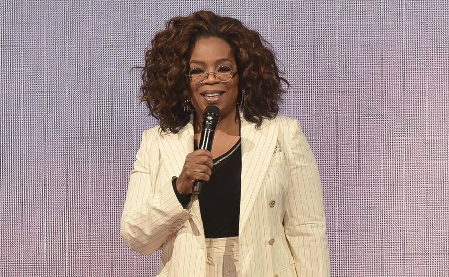 FILE - Oprah Winfrey makes opening remarks during &amp;quot;Oprah&#x27;s 2020 Vision&amp;quot; tour on Feb. 29, 2020, in Inglewood, Calif. Winfrey will have a biographical documentary released on Apple TV+. The streaming platform announced Thursday, Jan. 14, 2021, that the two-part documentary will focus on Winfrey&#x27;s life. (Photo by Richard Shotwell/Invision/AP, File)