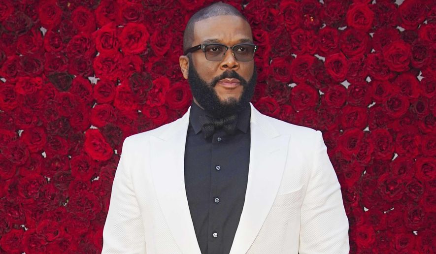 FILE - Tyler Perry poses at the grand opening of Tyler Perry Studios in Atlanta on Oct. 5, 2019.  Perry and the Motion Picture and Television Fund are being honored with the Jean Hersholt Humanitarian Award, the Academy of Motion Picture Arts and Sciences said Thursday. Perry and the MPTF will receive their Oscar statuettes at the 93rd Academy Awards on April 25.  (Photo by Elijah Nouvelage/Invision/AP, File)