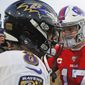 Buffalo Bills quarterback Josh Allen (17) talks with Baltimore Ravens quarterback Lamar Jackson (8) following a 24-17 Ravens win in an NFL football game in Orchard Park, N.Y., in this Sunday, Dec. 8, 2019, file photo. Buffalo&#x27;s Josh Allen and Baltimore&#x27;s Lamar Jackson become the first quarterbacks of the five-member 2018 first-round draft class set to meet in the playoffs as the Bills prepare to face the Ravens in the AFC divisional round on Saturday night, Jan. 16, 2021. (AP Photo/John Munson, File) **FILE**