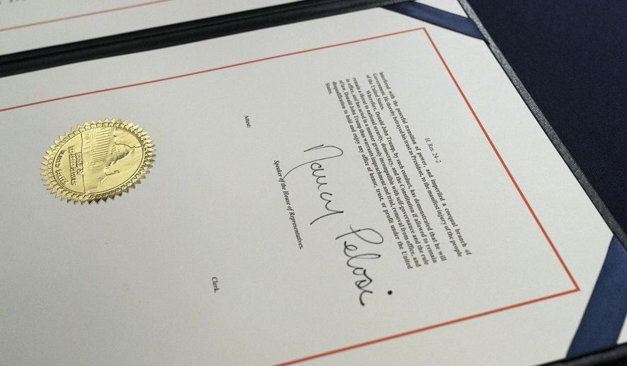 The signature of House Speaker Nancy Pelosi of Calif., is on the article of impeachment against President Donald Trump, after an engrossment ceremony before transmission to the Senate for trial on Capitol Hill, in Washington, Wednesday, Jan. 13, 2021. (AP Photo/Alex Brandon)