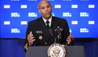 U.S. Surgeon General Jerome Adams speaks after receiving a Pfizer-BioNTech COVID-19 vaccine shot at the Eisenhower Executive Office Building on the White House complex, Friday, Dec. 18, 2020, in Washington.  Vice President Mike Pence, his wife Karen Pence, also received shots.  (AP Photo/Andrew Harnik)