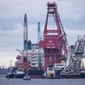 Tugboats get into position on the Russian pipe-laying vessel &amp;quot;Fortuna&amp;quot; in the port of Wismar, Germany, Thursday, Jan 14, 2021. The special vessel is being used for construction work on the German-Russian Nord Stream 2 gas pipeline in the Baltic Sea. (Jens Buettner/dpa via AP) ** FILE **