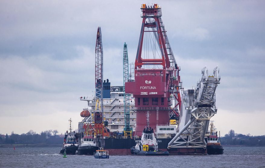 Tugboats get into position on the Russian pipe-laying vessel &amp;quot;Fortuna&amp;quot; in the port of Wismar, Germany, Thursday, Jan 14, 2021. The special vessel is being used for construction work on the German-Russian Nord Stream 2 gas pipeline in the Baltic Sea. (Jens Buettner/dpa via AP) ** FILE **