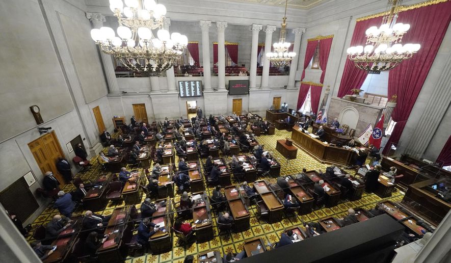 Members of the Tennessee House of Representatives conduct business on the first day of the legislative session Tuesday, Jan. 12, 2021, in Nashville, Tenn. Tennessee lawmakers gathered to start their annual session Tuesday in Nashville amid a pandemic and an FBI probe that drew searches of multiple legislative offices by federal agents last week. (AP Photo/Mark Humphrey)