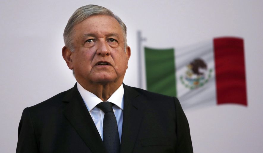 FILE - In this Dec. 1, 2020 file photo, Mexican President Andrés Manuel López Obrador attends the commemoration of his second anniversary in office at the National Palace in Mexico City. One day after Mexico’s Attorney General’s Office announced it was dropping the drug trafficking case against its former defense secretary, López Obrador said Friday, Jan. 15, 2020 that the U.S. Drug Enforcement Administration had “fabricated” the accusations against retired Gen. Salvador Cienfuegos. (AP Photo/Marco Ugarte, File)