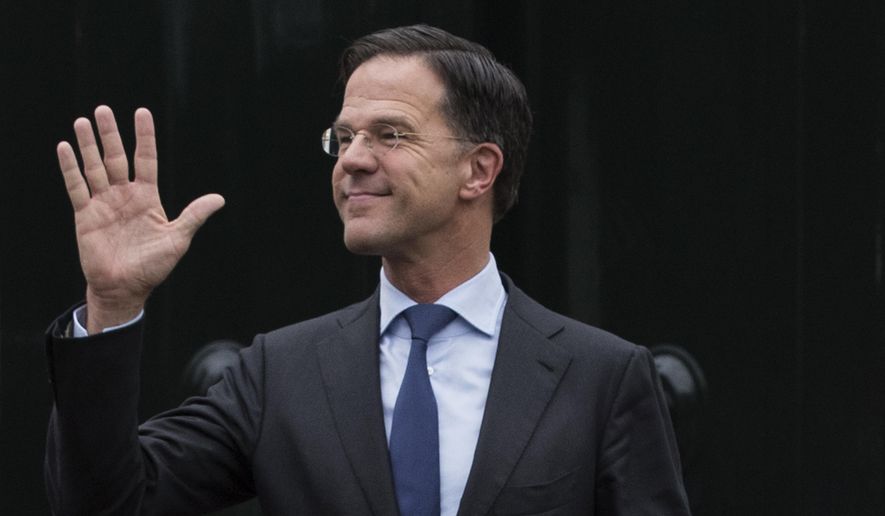 FILE- In this March 15, 2019, file photo, Dutch Prime Minister Mark Rutte waves as he waits for European Council President Donald Tusk to arrive for a meeting at Catshuis residence in The Hague, Netherlands. The Dutch Cabinet was set to meet Friday Jan. 15, 2021, amid strong speculation that Prime Minister Mark Rutte's government will resign to take political responsibility for a scandal involving child benefit investigations. (AP Photo/Peter Dejong, File)