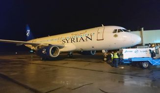 In this photo released by the Syrian official news agency SANA, a Syrian commercial plane coming from Lebanon, lands at Aleppo Airport, Syria, early Friday, Jan. 15, 2021. Syrian Air conducted its first flight in a decade between the northern city of Aleppo and Lebanon&#39;s capital Beirut on Friday, resuming a round-trip route that&#39;s been halted since Syria’s conflict began in 2011. (SANA via AP)