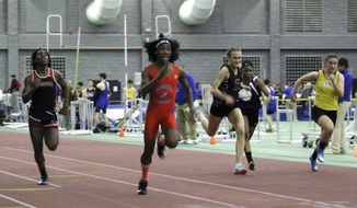 In this Feb. 7, 2019, file photo, Bloomfield High School transgender athlete Terry Miller, second from left, wins the final of the 55-meter dash over transgender athlete Andraya Yearwood, far left, and other runners in the Connecticut girls Class S indoor track meet at Hillhouse High School in New Haven, Conn. (AP Photo/Pat Eaton-Robb, File)