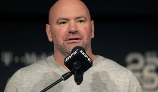 FILE - In this Nov. 2, 2018, file photo, UFC president Dana White speaks at a news conference in New York. The first of three straight fight nights at Etihad Arena on Abu Dhabi’s Yas Island kicks off Saturday, Jan. 16, when Max Holloway fights Calvin Kattar in a 145-pound bout in the main event of the first combat sports card aired on ABC since 2000. In UFC 257 on Jan. 24, Conor McGregor returns from a year-long layoff for a rematch against Dustin Poirier in the promotions&#39;s first pay-per-view of the year. (AP Photo/Julio Cortez, File)