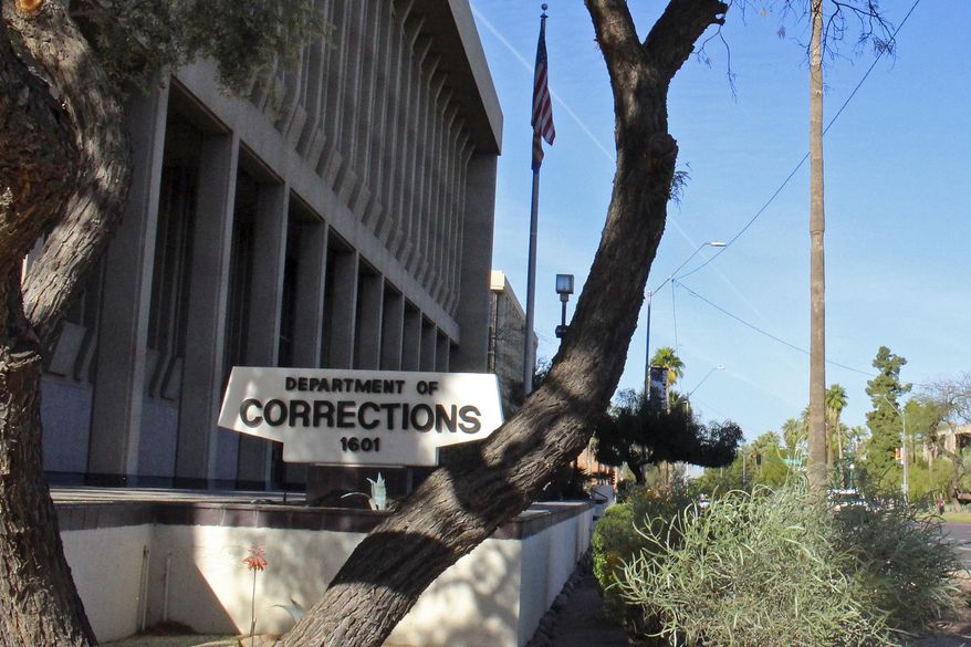 FILE - In this March 16, 2016, file photo, is the Arizona Department of Corrections, Rehabilitation and Reentry headquarters in Phoenix. Prison officials will start offering COVID-19 vaccinations on Friday, Jan. 15, 2021, to corrections officers at the Perryville prison in Goodyear, with other prisons to follow in the future. State corrections officers can get vaccinated through either the corrections department or through counties where they work, some of which are already making vaccines available to them. (AP Photo/Bob Christie, File)