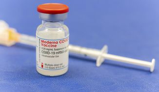 An ampoule Moderna vaccine against the COVID-19 disease, stand on the table at the Diakonie Hospital &amp;quot;DIAKO&amp;quot; vaccination ward in Bremen, Germany, Friday, Jan. 15, 2021. Besides the Pfizer/BioNTech vaccine, Moderna is the second corona vaccine approved in the European Union. (Mohssen Assanimoghaddam/dpa via AP)