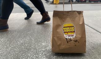 A bag of MrBeast burgers, delivered to the parking lot of the Town Center Barnes &amp;amp; Noble in Virginia Beach, Va., in January 2021. MrBeast is not a traditional restaurant, in the sense that you can’t actually go there. They also lack so much as a phone number. The burger spot instead has a shadowy and somewhat tenuous existence: findable only on delivery apps, and only if your address happens to fall within the delivery radius. (Matthew Korfhage/The Virginian-Pilot via AP)