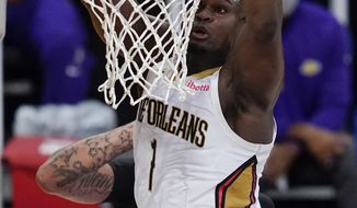 New Orleans Pelicans forward Zion Williamson dunks during the third quarter of the team&#39;s NBA basketball game against the Los Angeles Lakers on Friday, Jan. 15, 2021, in Los Angeles. (AP Photo/Ashley Landis)