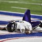 Baltimore Ravens quarterback Lamar Jackson (8) lies on the ground after being injured during the second half of an NFL divisional round football game against the Buffalo Bills Saturday, Jan. 16, 2021, in Orchard Park, N.Y. Jackson left the game after his injury. (AP Photo/Adrian Kraus)