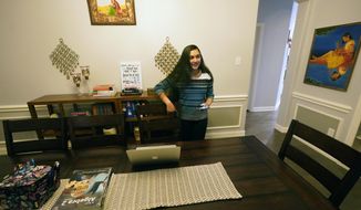 Charvi Goyal, 17, prepares to jump online for a tutoring session she gives to a junior high student from her family&#39;s home Monday, Jan. 4, 2021, in Plano, Texas. Goyal is part of a group of high school students that put together their own volunteer online tutoring service to help k-12 during the pandemic. (AP Photo/LM Otero)