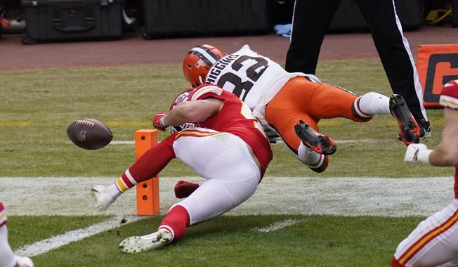 Cleveland Browns wide receiver Rashard Higgins (82) fumbles the ball over Kansas City Chiefs safety Daniel Sorensen at the goal line during the first half of an NFL divisional round football game, Sunday, Jan. 17, 2021, in Kansas City. (AP Photo/Orlin Wagner)