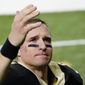 New Orleans Saints quarterback Drew Brees waves to his family and fans after an NFL divisional round playoff football game against the Tampa Bay Buccaneers, Sunday, Jan. 17, 2021, in New Orleans. The Buccaneers won 30-20. (AP Photo/Brynn Anderson) **FILE**
