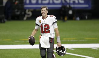 Tampa Bay Buccaneers quarterback Tom Brady leaves the field an NFL divisional round playoff football game against the New Orleans Saints, Sunday, Jan. 17, 2021, in New Orleans. The Buccaneers won 30-20. (AP Photo/Brett Duke) **FILE**
