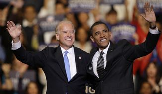 FILE - In this Oct. 29, 2008, file photo Vice presidential candidate Joe Biden, D-Del., left, and Democratic presidential candidate Sen. Barack Obama, D-Ill., right, wave during a rally at the Bank Atlantic Center in Sunrise, Fla. (AP Photo/Lynne Sladky, File)
