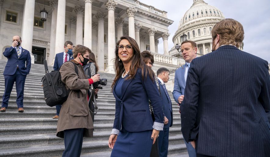 In this Jan. 4, 2021, file photo, Rep. Lauren Boebert, R-Colo., center, joins other freshman Republican House members for a group photo at the Capitol in Washington. (AP Photo/J. Scott Applewhite, File)