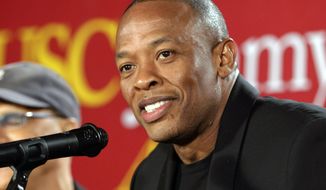 FILE - This May 15, 2013 file photo shows hip-hop mogul Dr. Dre as he announces a $70 million dollar donation to create the new &amp;quot;Jimmy Iovine and Andre Young Academy for Arts and Technology and Business Innovation,&amp;quot; at the University of Southern California, in Santa Monica, Calif. Music mogul Dr. Dre was back at home Saturday, Jan 16, 2021, after being treated at a Los Angeles hospital for a reported brain aneurysm. Peter Paterno, an attorney for the rapper and producer, said Dre was home but offered no other details in an email exchange Saturday.  (AP Photo/Damian Dovarganes, File)