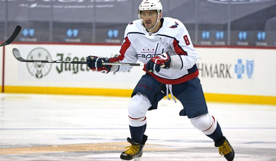 Washington Capitals&#39; Alex Ovechkin (8) skates during the second period of an NHL hockey game against the Pittsburgh Penguins in Pittsburgh, Sunday, Jan. 17, 2021. (AP Photo/Gene J. Puskar)
