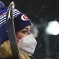 United States&#39; Mikaela Shiffrin wears a face mask as she waits for the podium ceremony after winning an alpine ski, women&#39;s World Cup slalom in Flachau, Austria, Tuesday, Jan. 12, 2021. (AP Photo/Giovanni Auletta)