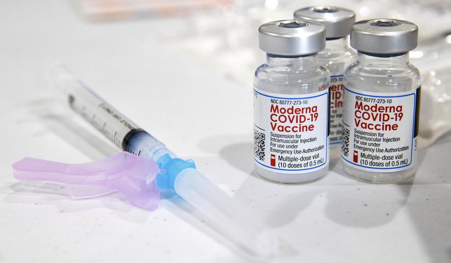 FILE - In this Jan. 9, 2021, file photo, vials of the Moderna COVID-19 vaccine are placed next to a loaded syringe in Throop, Pa. On Sunday, Jan. 17, 2021, California&#39;s state epidemiologist Dr. Erica S. Pan  recommended providers stop using lot 41L20A of the Moderna vaccine pending completion of an investigation by state officials, Moderna, the U.S. Centers for Disease Control and the federal Food and Drug Administration, because some people received medical treatment for possible severe allergic reactions. (Christopher Dolan/The Times-Tribune via AP, File)