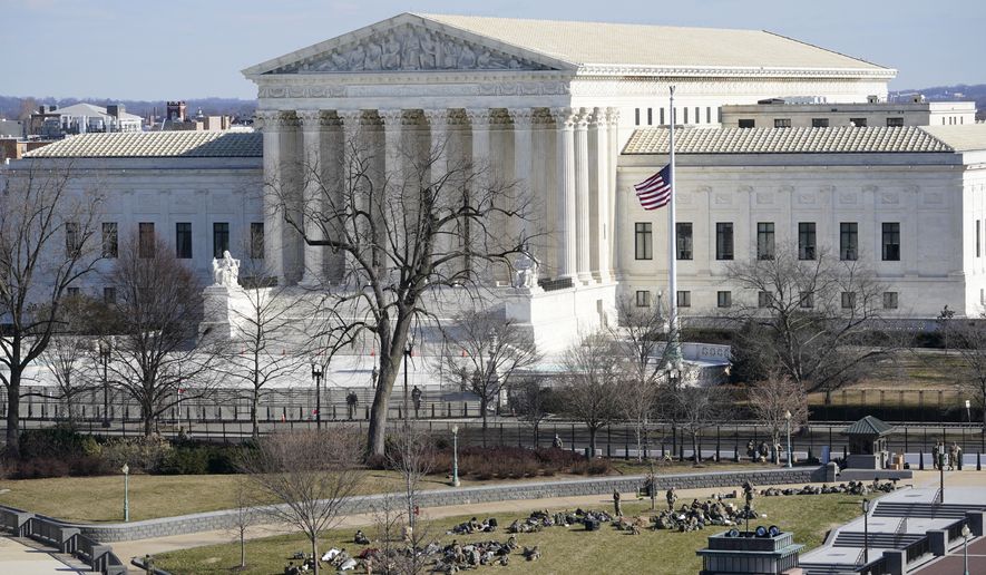 A view of the Supreme Court in Washington, Tuesday, Jan. 19, 2021, ahead of the 59th Presidential Inauguration on Wednesday. (AP Photo/Susan Walsh, Pool)