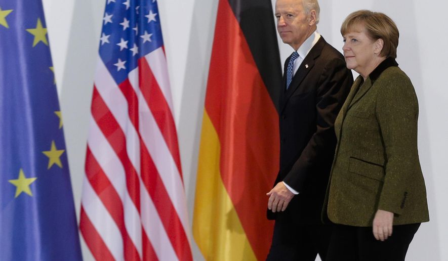 File---File picture taken Friday, Feb. 1, 2013 shows German Chancellor Angela Merkel, right, and United States&#x27; Vice President Joe Biden at the chancellery in Berlin, Germany.   (AP Photo/Markus Schreiber,file)